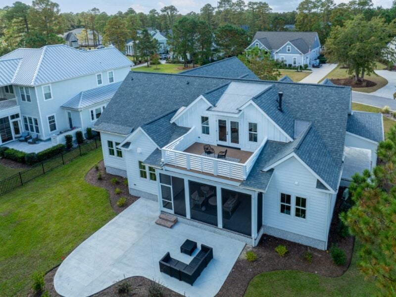 White Custom Home with an Exterior Aerial view showing the roof design